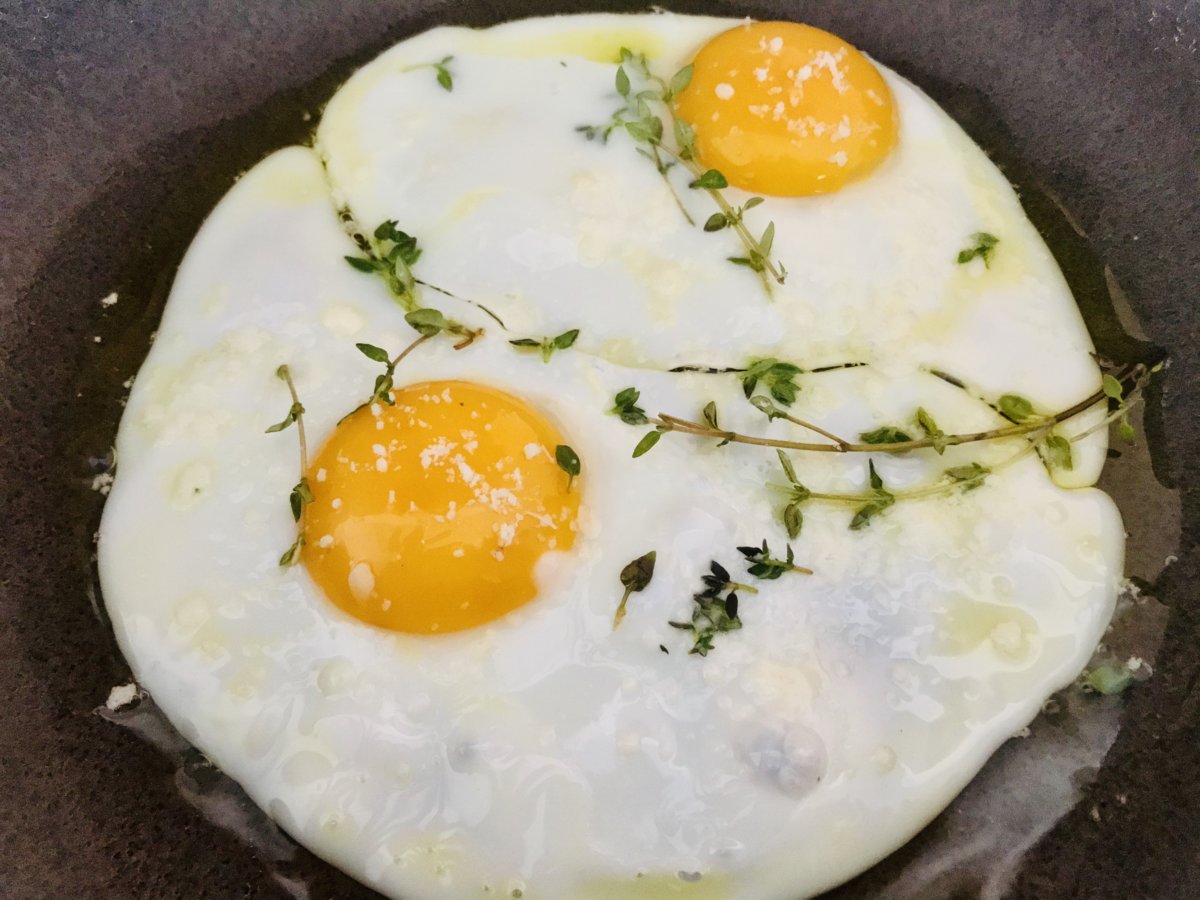 Fried Eggs topped with thyme and Parmigiano.jpeg