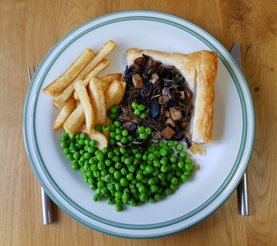 Mushroom Tart with chips and peas