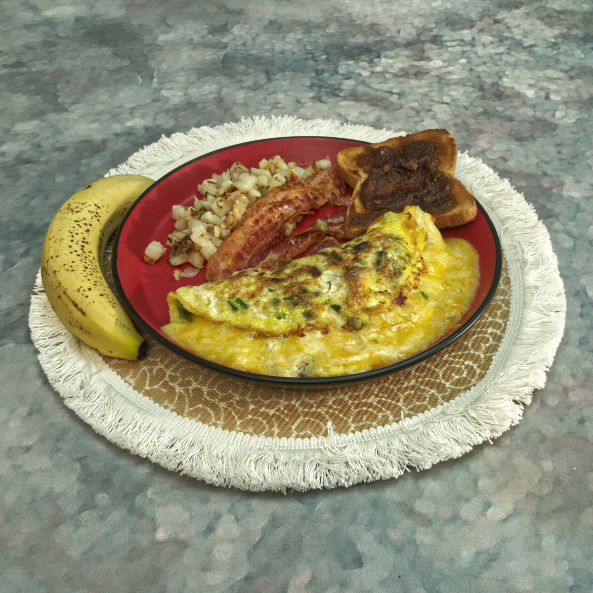 Omelette, Bacon, O'Brien Hash Browns and Apple Pecan Butter Toast with a Banana