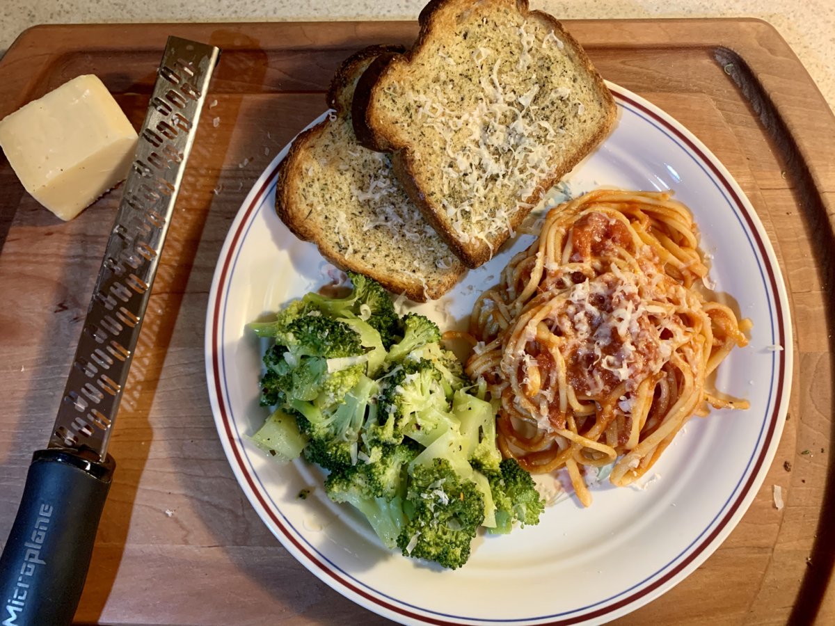 Pasta, Red Sauce, Broccoli, And Garlic Toast