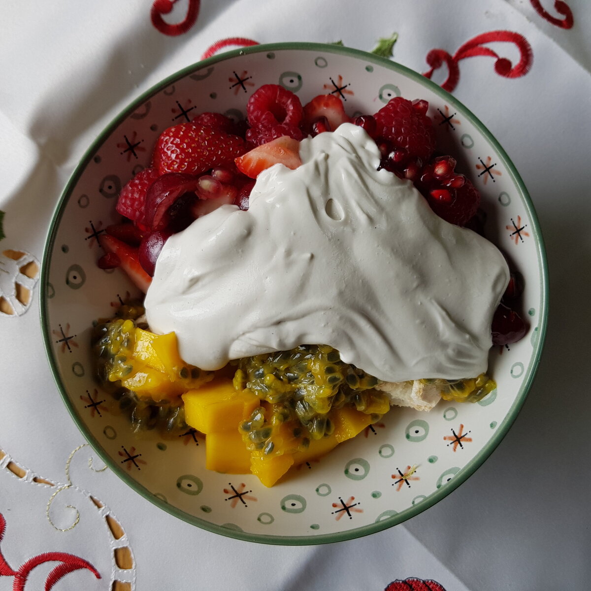 Pavlova with fresh fruit and cashew & coconut cream