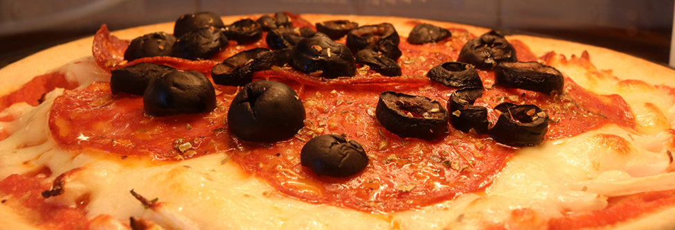 Pepperoni and black olives pizza