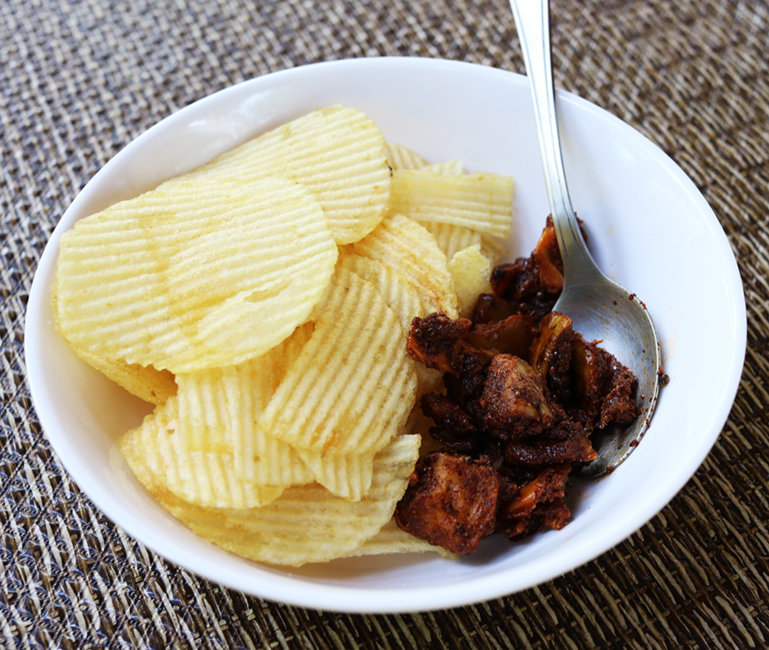 Pickle with potato crisps.