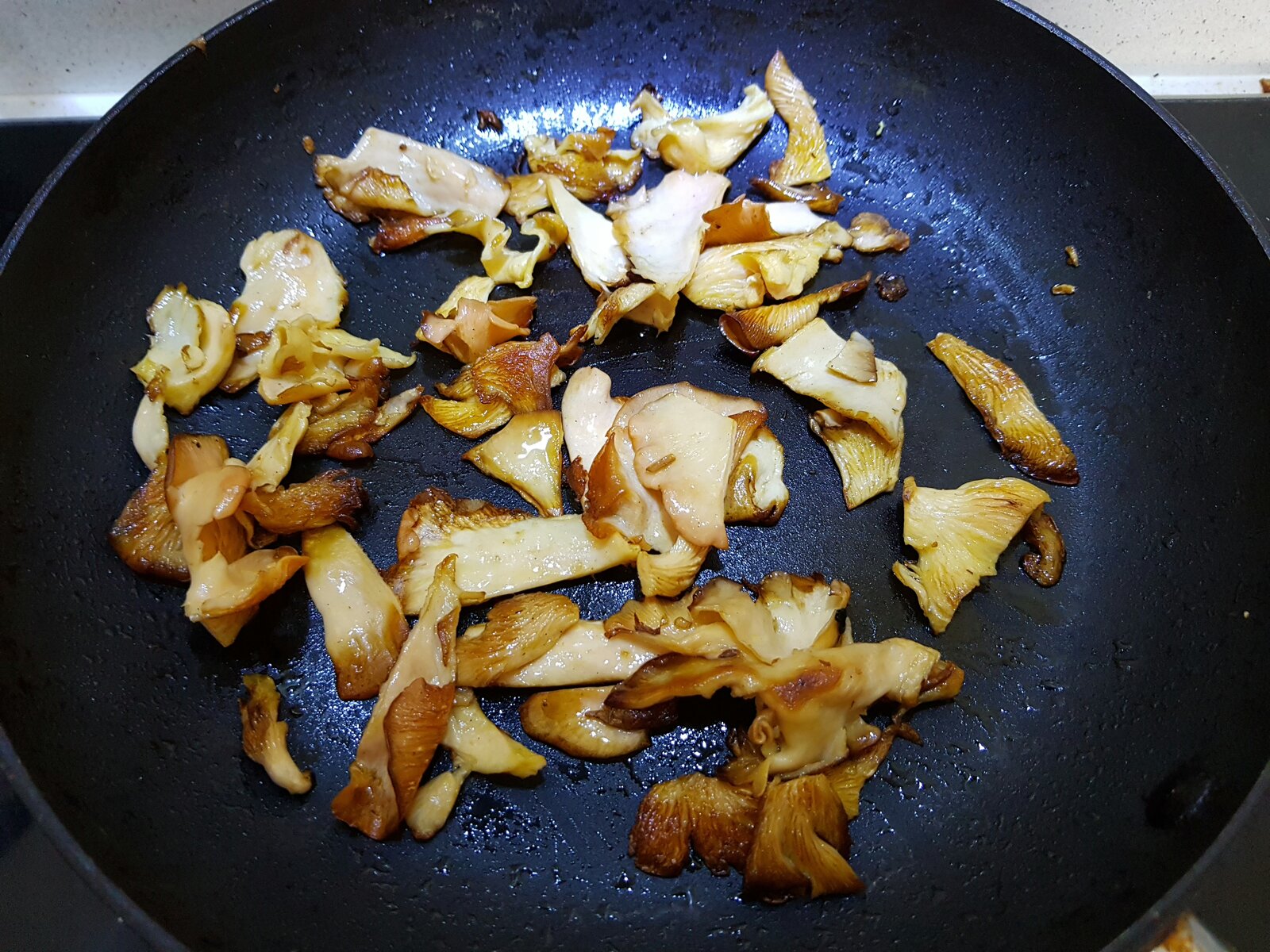 Pink oyster mushrooms cooking