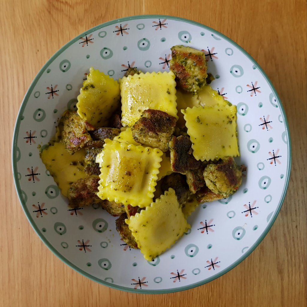 Pumpkin ravioli with vegan chicken and basil pesto