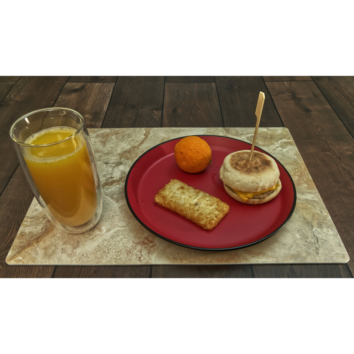 Sausage, Egg and Cheese Muffin with a Hash Brown Patty, an Orange and Orange Juice