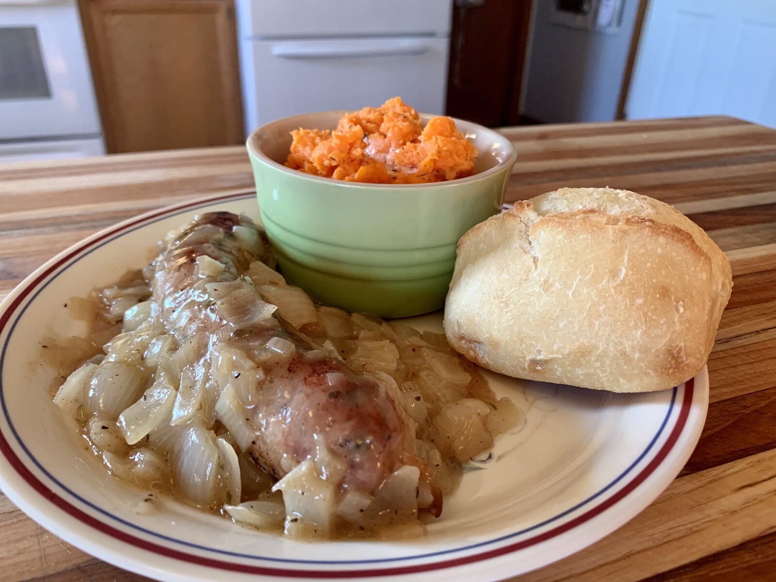 Sausage In Wine W/ Mashed Carrot & Crusty Roll