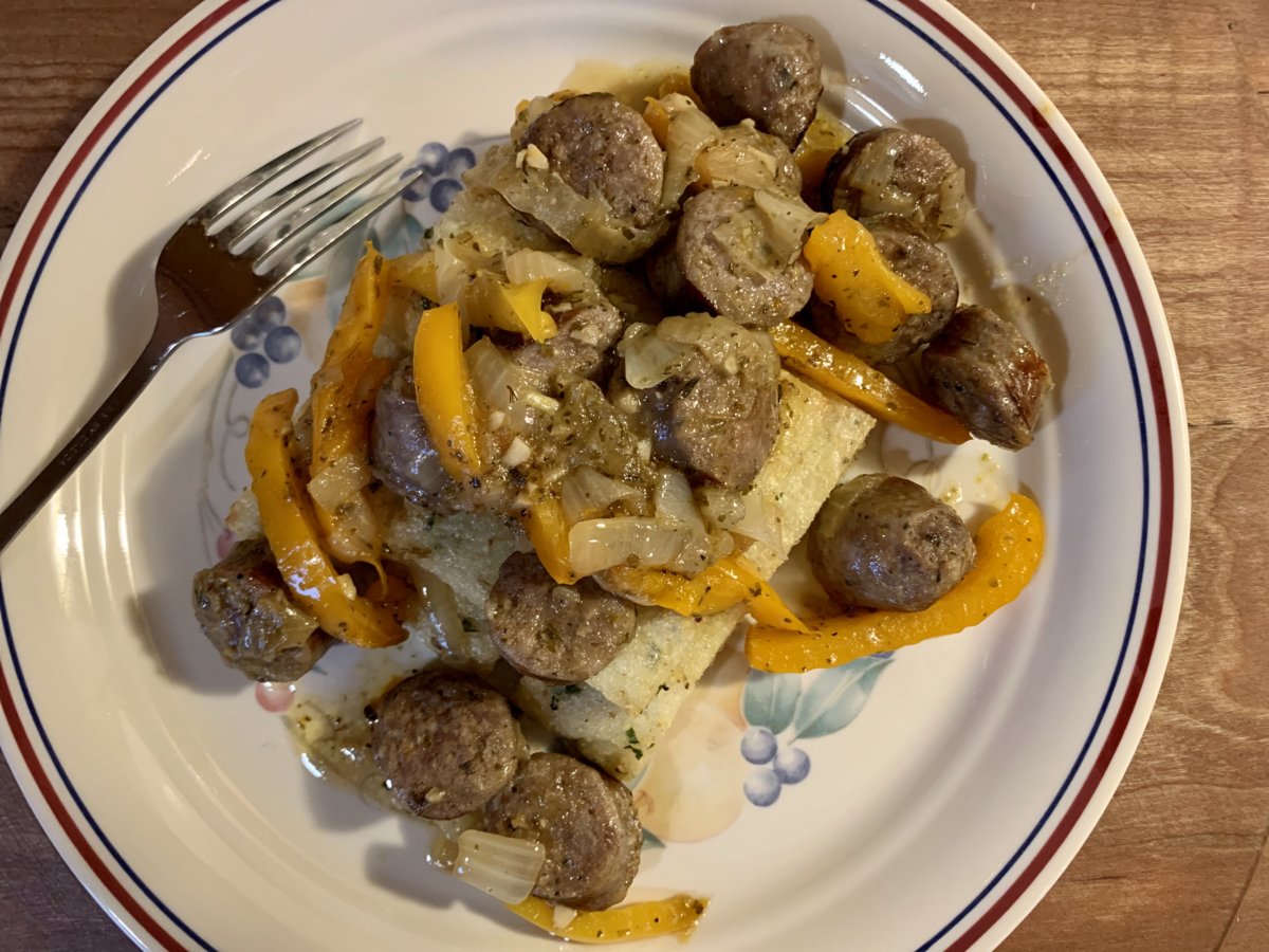 Sausage, Peppers, And Onions Over Broiled Polenta