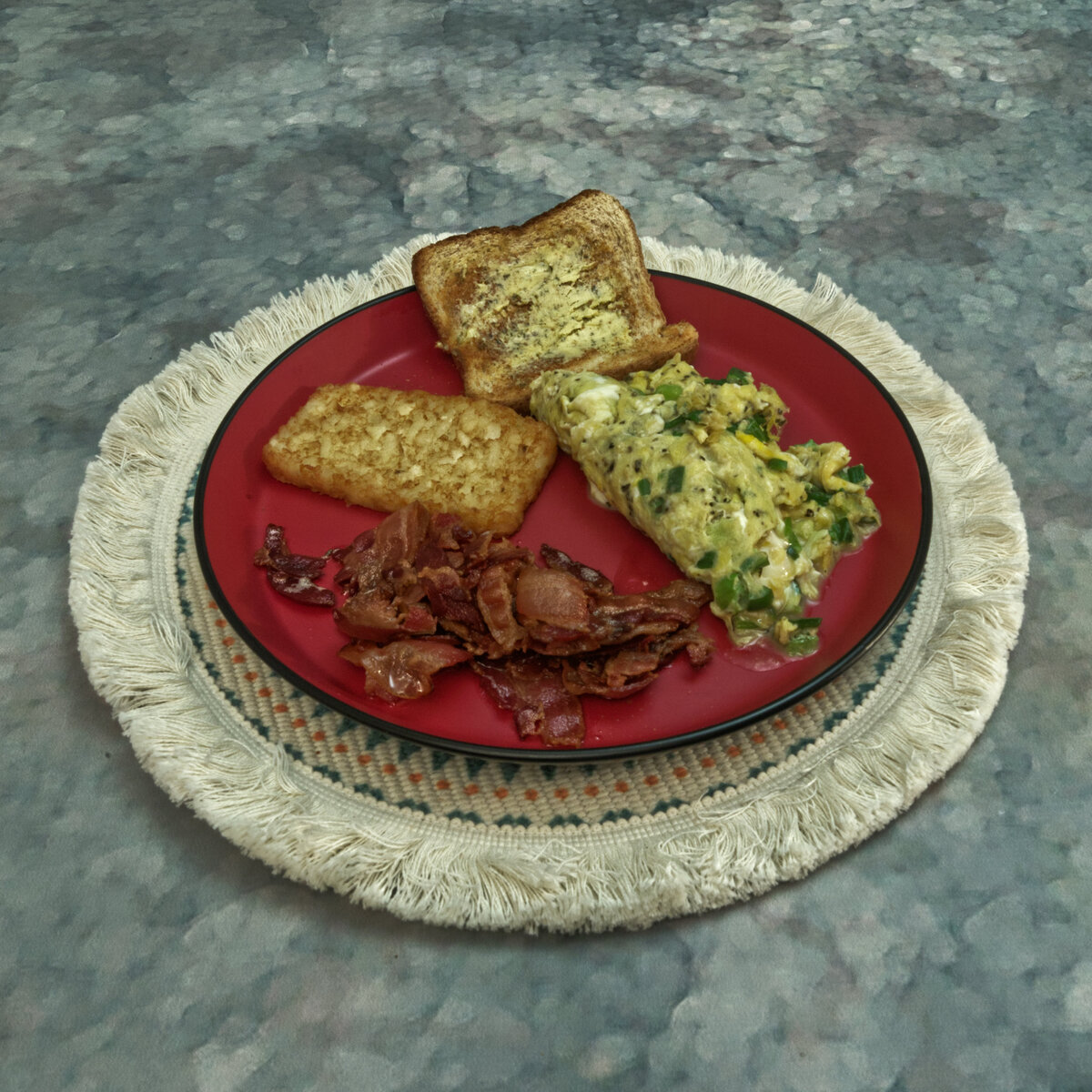 Scrambled Eggs, Bacon, Garlic Buttered Toast and a Hash Brown Patty