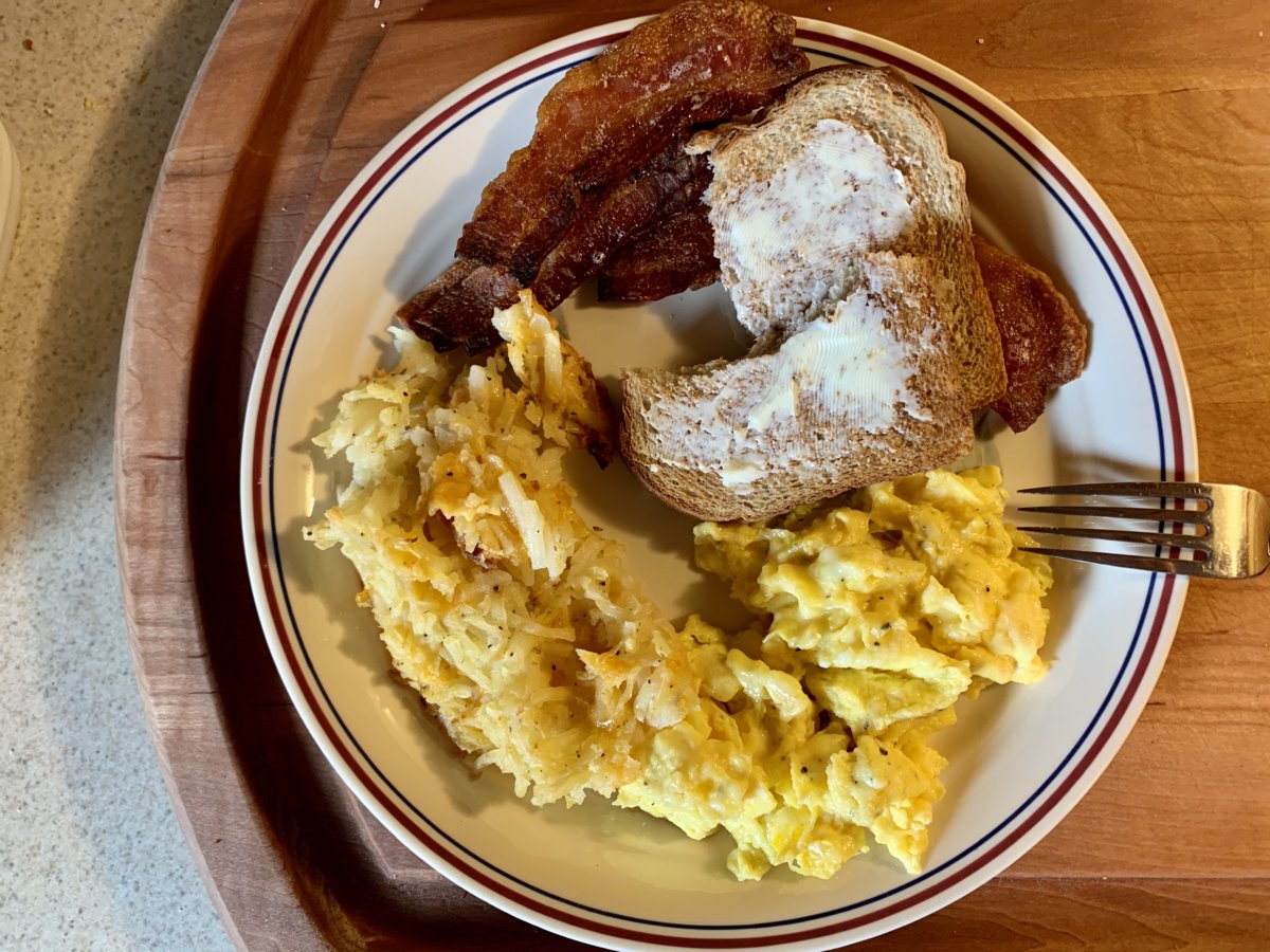 Scrambled Eggs With Butter Cheese, Hash Brown Casserole, Bacon, And Toast