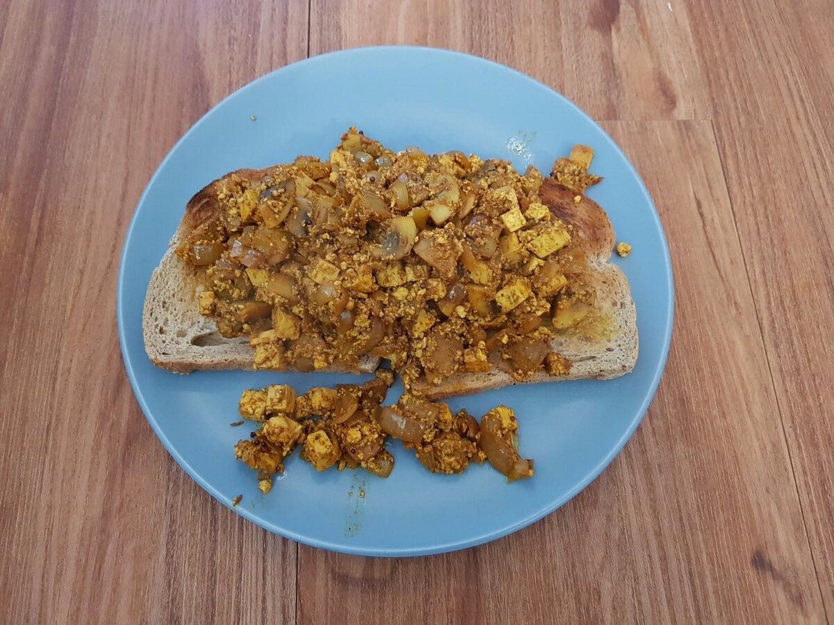 Scrambled tofu with mushrooms & onions on toast