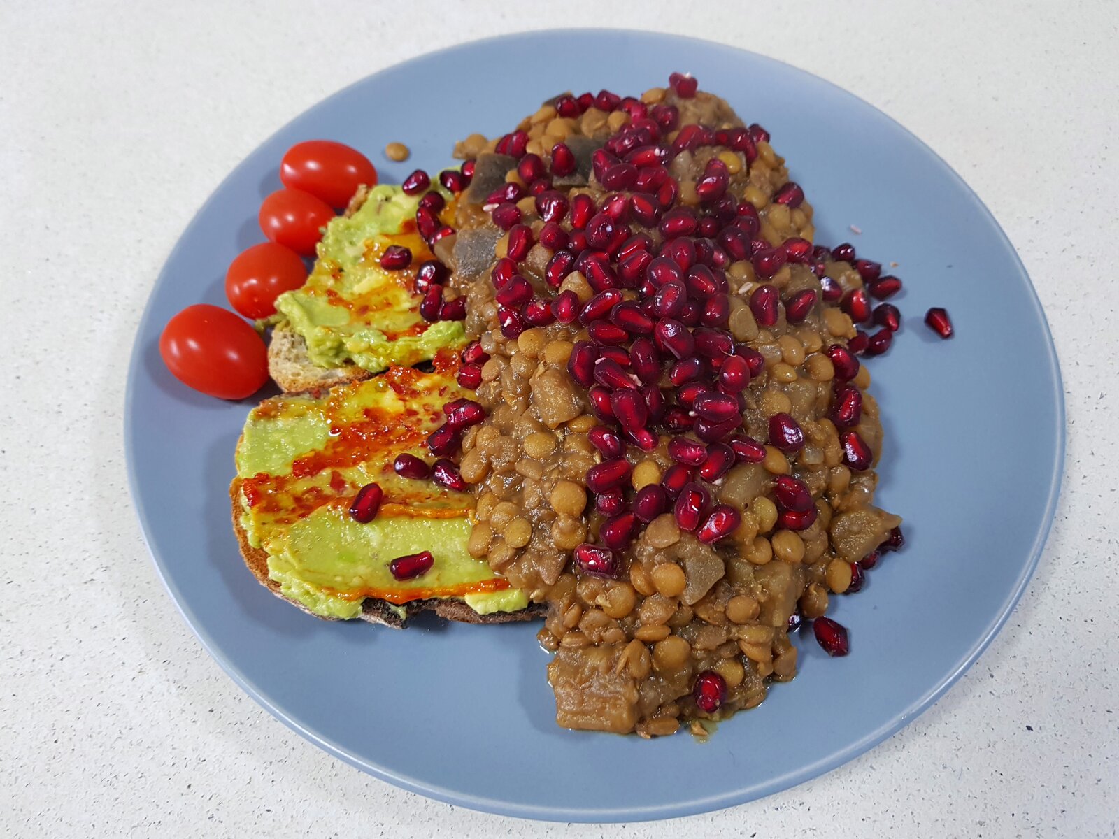 Smashed avo on Sourdough toast with Rummaniyeh and Shatta