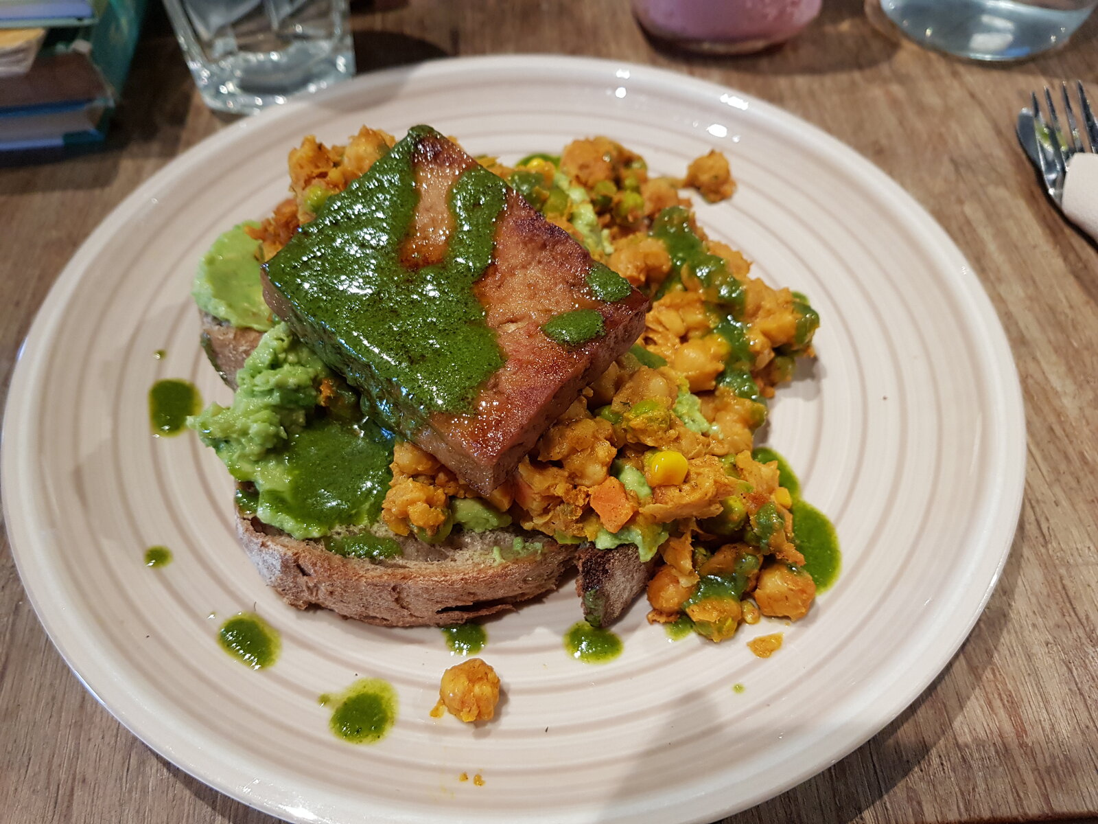 Smashed chickpea & avocado on sourdough with a tofu steak