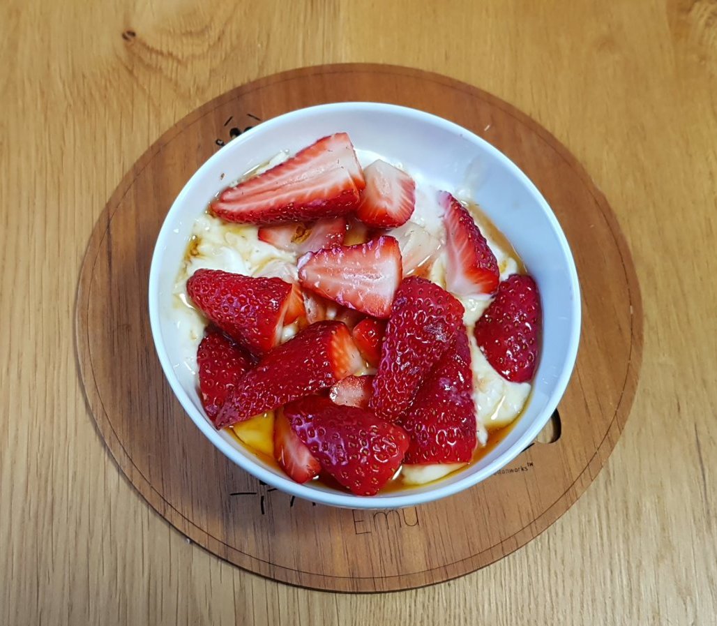 Strawberries, maple syrup, soaked oats in soya yoghurt