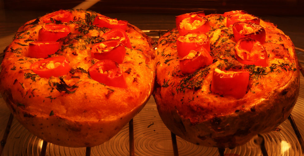 Stuffed jacket potatoes with fresh cayenne chillis.