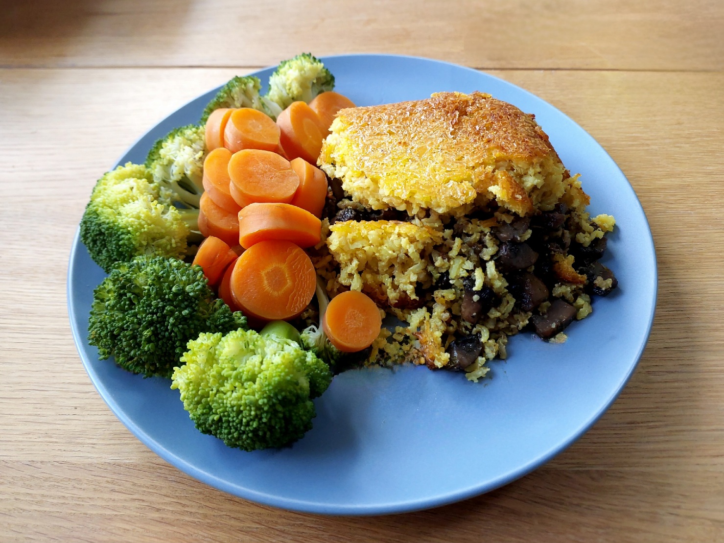 Tahchin - stuffed with herby mushrooms, served with broccoli and carrots