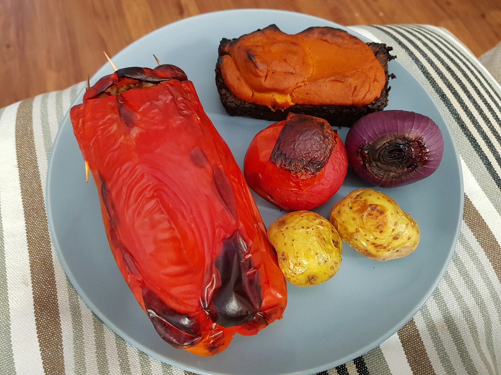 Tempeh loaf, roasted stuffed red pepper & veg