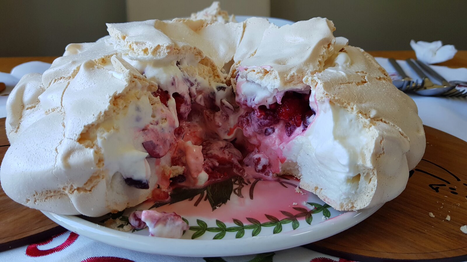The pavlova with whipped cream and red berries (dairy free)