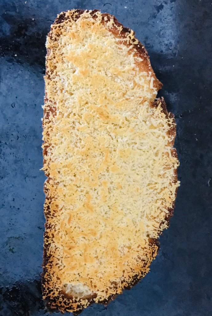 Toasted bread with grated Parmigiano.jpeg