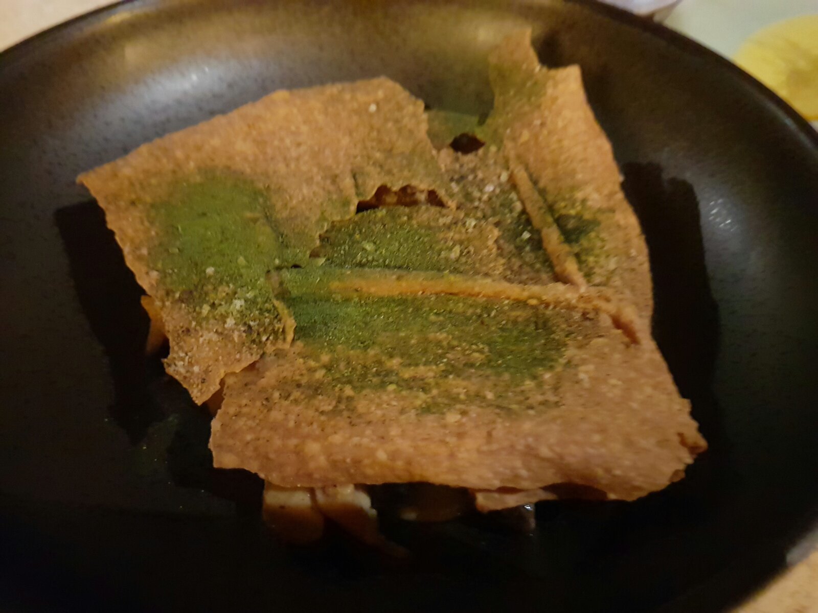 Underneath is a bed of Wild mushrooms with a delicious truffle sauce served with a crisp bread of some sort